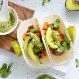 spiced sweet potato tacos with avocado cilantro crema